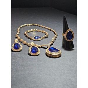 Gold tone blue rhinestone necklace, bracelet, earring and ring set